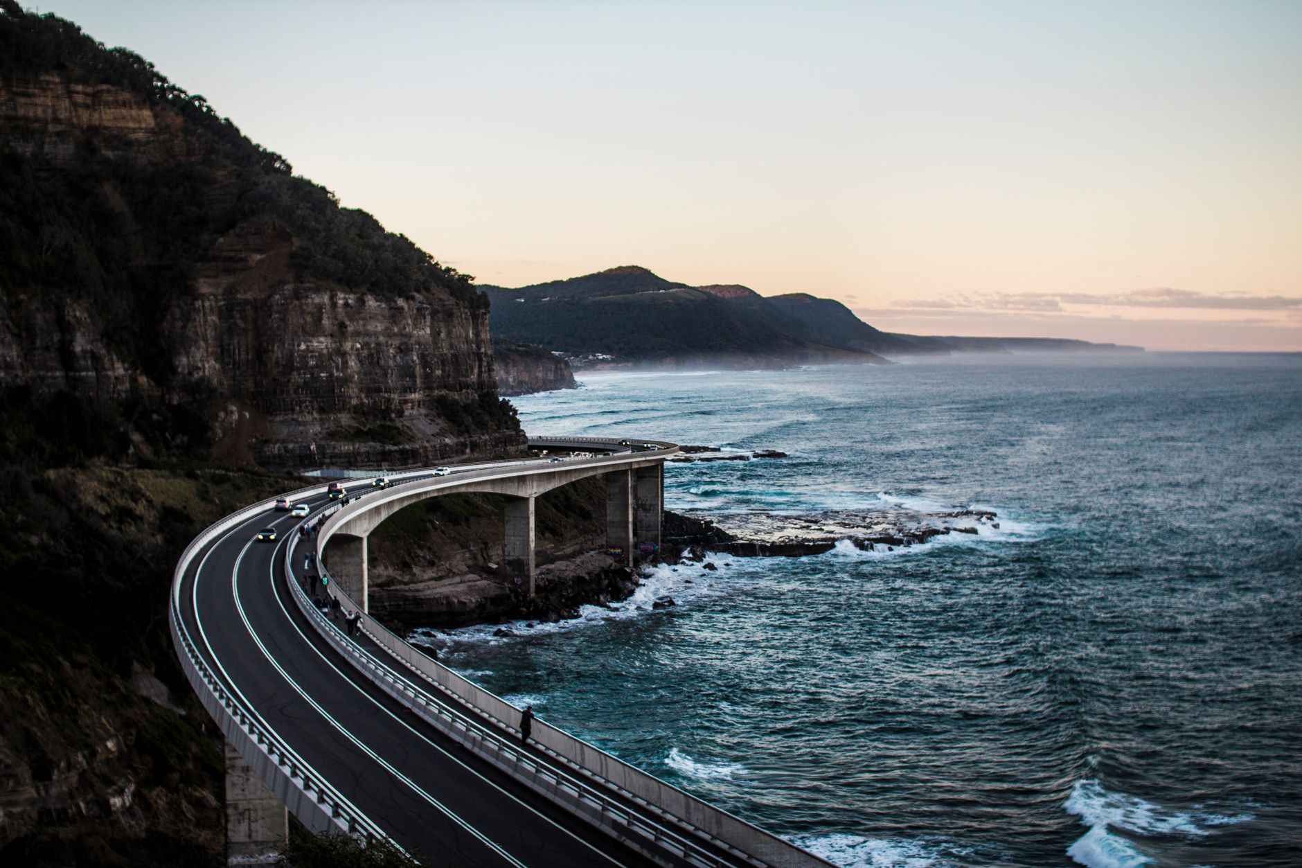 Coastal drive with dramatic ocean waves